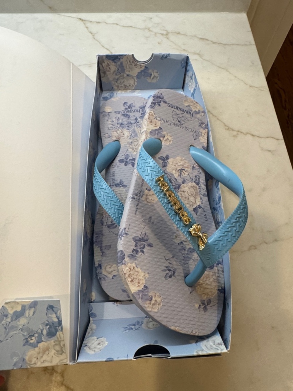 Havaianas by LOVE SHACK FANCY Light Blue Floral Flip Flops with Gold Accents
